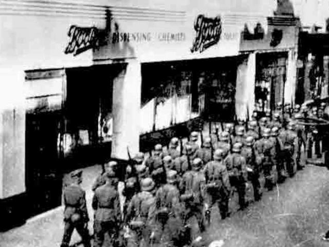 Germans marching past Boots in Queen St